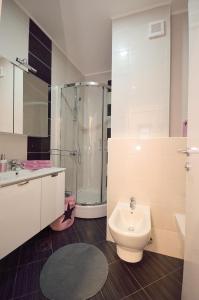 a bathroom with a toilet and a shower at Apartment Josip 2 in Tribunj