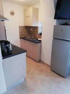 Kuchyň nebo kuchyňský kout v ubytování Apartment Surdić