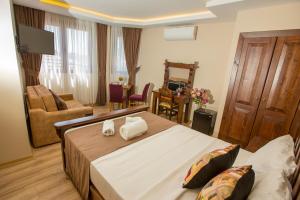 Postel nebo postele na pokoji v ubytování The PeraPort Hotel