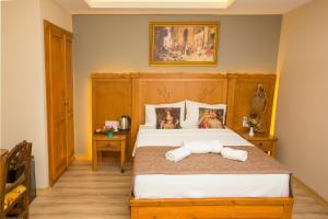 Postel nebo postele na pokoji v ubytování The PeraPort Hotel