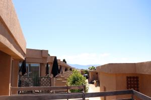 a view from the balcony of a resort with mountains in the background at Hotel Stella Di Mare in Ajaccio +11 photos