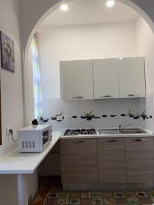 Kuchyň nebo kuchyňský kout v ubytování CASA VACANZA FERRARI