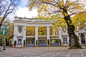 a large building with a tree in front of it at Studio Liberty in Fiuggi