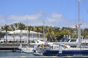 a group of boats docked at a marina at Velero MissTick,Gibsea 47'2 in Puerto Calero