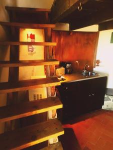 a kitchen with a counter and a sink in a room at Moinho da Senta in Rio Maior