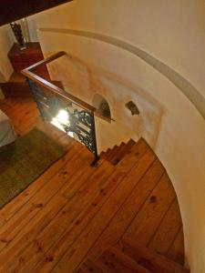 a stairway with a railing and a wooden floor at Moinho da Senta in Rio Maior