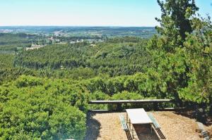 a bench sitting on top of a hill with trees at Moinho da Senta in Rio Maior