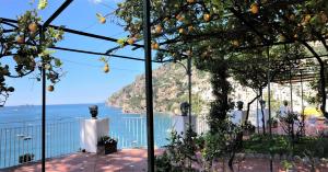a view of the ocean from the balcony of a house at Hotel Marincanto in Positano