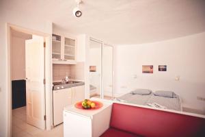 a kitchen with a table with a bowl of fruit on it at Studio - Agua - Surf & Yoga Villa in La Pared