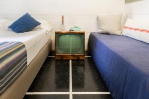 Voodi või voodid majutusasutuse Hotel Blu di Te toas