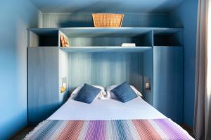 Voodi või voodid majutusasutuse Hotel Blu di Te toas