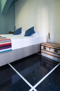 Voodi või voodid majutusasutuse Hotel Blu di Te toas