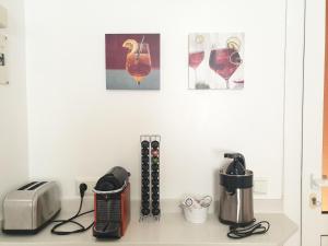 a kitchen counter with a toaster toaster and a toaster at Sunny & New Apartamento in Caleta de Fuste in Caleta De Fuste
