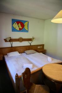 Voodi või voodid majutusasutuse Hotel Schwarzer Adler Sillian toas