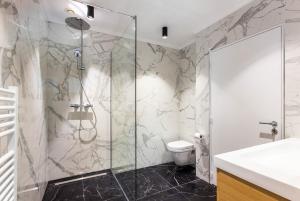 a bathroom with a shower and a toilet at CMG Champs Elysées - Boetie 6 in Paris