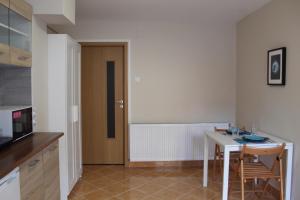 Kuchyň nebo kuchyňský kout v ubytování Korall Apartman