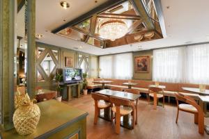 TV a/nebo společenská místnost v ubytování Tulip Inn Beaulieu Lausanne