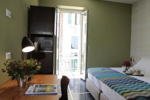 Voodi või voodid majutusasutuse Hotel Blu di Te toas