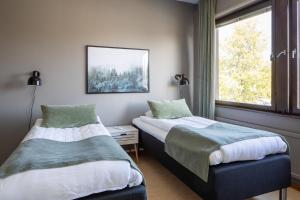 Postel nebo postele na pokoji v ubytování Hotel B&B Gränden