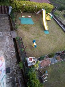 an aerial view of a playground with a slide at Casa Vacanza PIZZO CAMINO in Calasca Castiglione