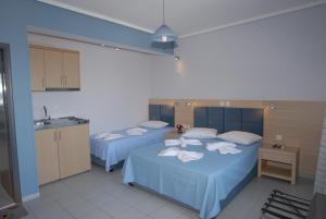 Кровать или кровати в номере Irene ROOMS & STUDIOS PETRA