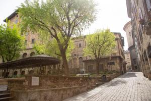 a cobblestone street in the middle of a city at Casa Vacanze Gombito 4 Bergamo Alta in Bergamo