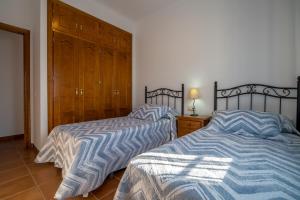 Posteľ alebo postele v izbe v ubytovaní Chalet adosado Atalaya P