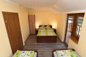 Ein Bett oder Betten in einem Zimmer der Unterkunft Noclegi u Bartka i Magdy