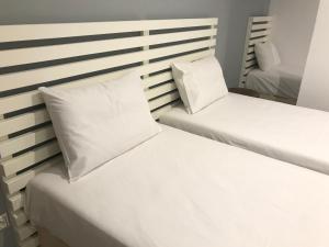 Postel nebo postele na pokoji v ubytování VIAL Rooms