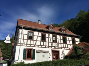 a large white building with a red roof at Großherzögliches Jägerhaus in Bensheim