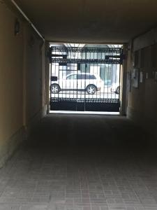 a hallway with a window with a car in a parking lot at Guest House "Nevsky 6" in Saint Petersburg