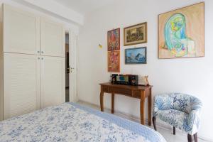 A bed or beds in a room at Splendida Casa A Taormina " Casa di Anna "