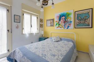 A bed or beds in a room at Splendida Casa A Taormina " Casa di Anna "