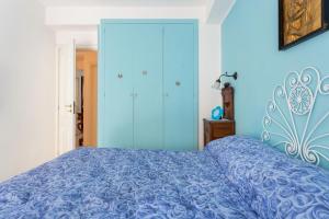 A bed or beds in a room at Splendida Casa A Taormina " Casa di Anna "