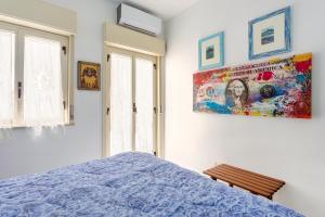 A bed or beds in a room at Splendida Casa A Taormina " Casa di Anna "