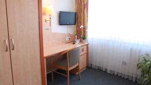 TV a/nebo společenská místnost v ubytování Hotel Wetterau - Self-Check-In