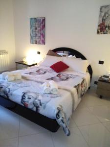 a bedroom with a large bed in a room at Casa Silvia in Caltagirone