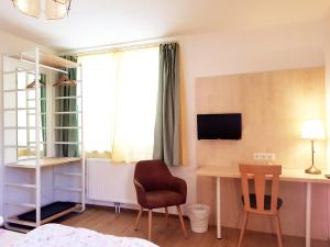 Telewizja i/lub zestaw kina domowego w obiekcie Aparthotel Pan Haus
