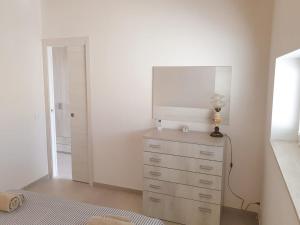 Postel nebo postele na pokoji v ubytování A(m)mare - casa vacanze