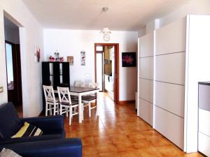 a living room and dining room with a table and chairs at Apartment Altemar in Las Americas in Playa de las Americas