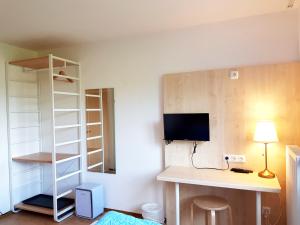 Telewizja i/lub zestaw kina domowego w obiekcie Aparthotel Pan Haus