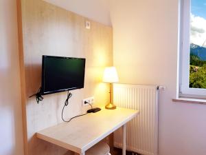 Telewizja i/lub zestaw kina domowego w obiekcie Aparthotel Pan Haus