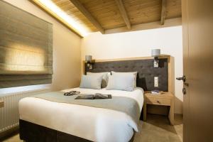 En eller flere senge i et værelse på Meteora boutique villa E