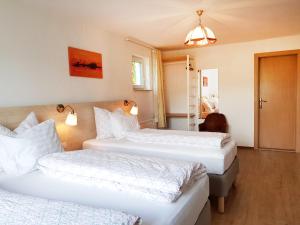 Łóżko lub łóżka w pokoju w obiekcie Aparthotel Pan Haus