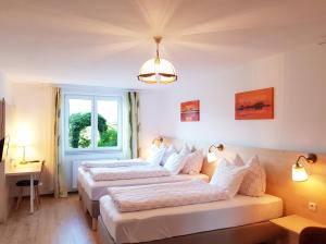 Łóżko lub łóżka w pokoju w obiekcie Aparthotel Pan Haus