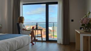 Łóżko lub łóżka w pokoju w obiekcie Hotel Costa da Morte