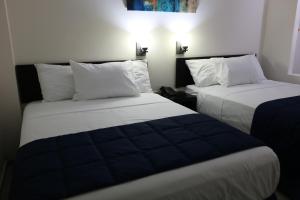 Postel nebo postele na pokoji v ubytování Hotel MB