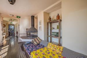 a living room with a couch and a stove at Botanico Hostel in Bogotá