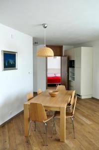 a dining room with a wooden table and chairs at Bratislava Castle Hill Apartment in Bratislava