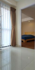 A bed or beds in a room at Sayami Home